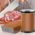 A knife slicing meat, with the sharpener's roller and the 20° side of its magnetic base shown alongside.