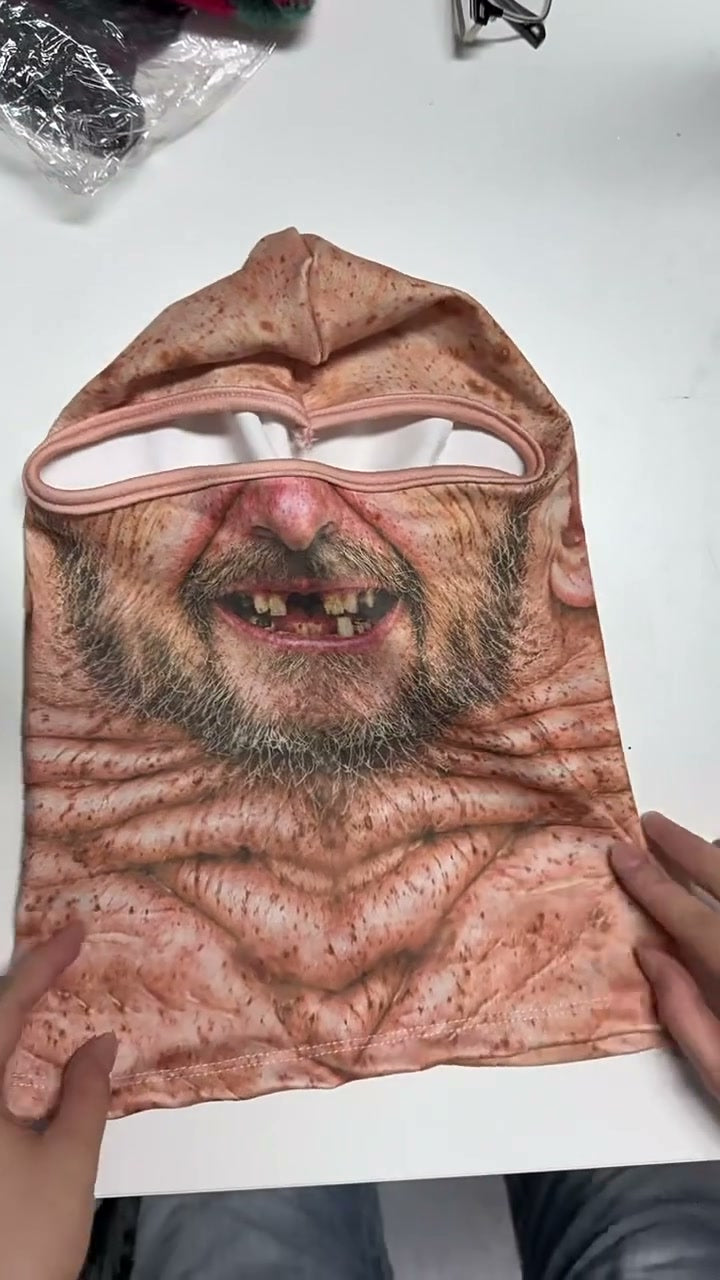 The mask laid flat and held open