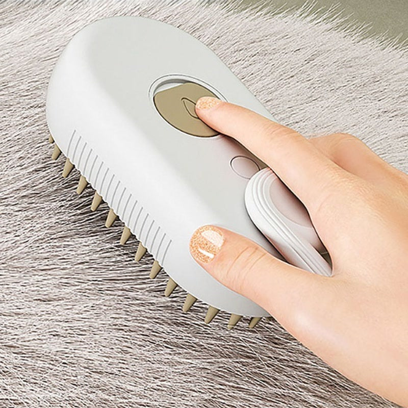 A hand using the brush on a long haired cat
